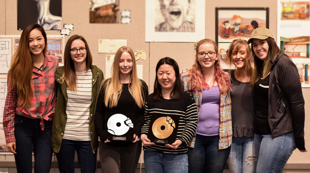 La Roche design students showing off artwork in the Cantellops Art Gallery